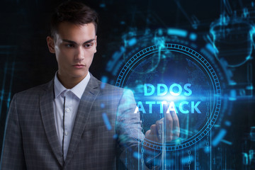 The concept of business, technology, the Internet and the network. A young entrepreneur working on a virtual screen of the future and sees the inscription: Ddos attack