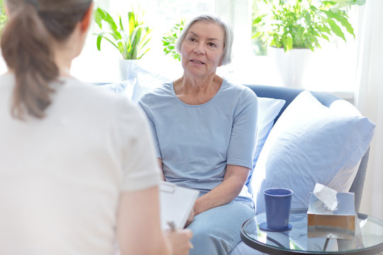 Talk Therapy Concept: Female Doctor Talking With Her Senior Patient About Her Problems During A Counseling Session.