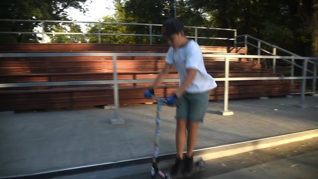 Child doing tricks on scooter