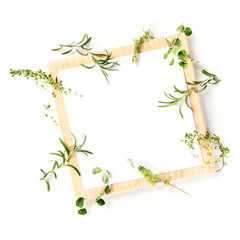 Cooking a Recipe Design Template. A clipboard with aromatic kitchen herbs, shot from the top on a white background with a place for text