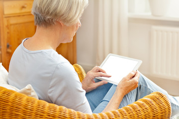technology and senior people concept, elderly woman with tablet computer at home, touching blank screen