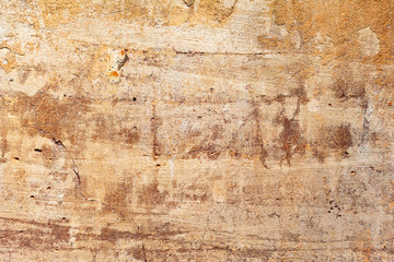 Texture of a concrete wall with cracks and scratches which can be used as a background