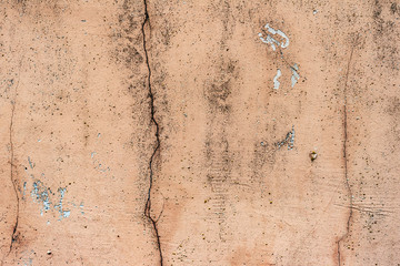 Texture of a concrete wall with cracks and scratches which can be used as a background