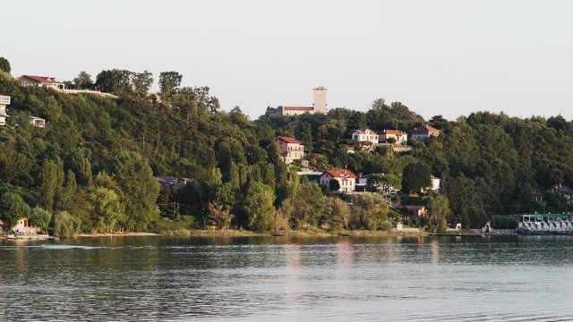 Green landscape with the Rocca of Angera in the background on Lake Maggiore