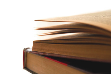 Open book, hardback books on bright colorful background.