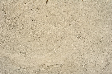 Texture of a concrete wall with cracks and scratches which can be used as a background