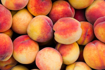 Background of fresh ripe organic peaches
