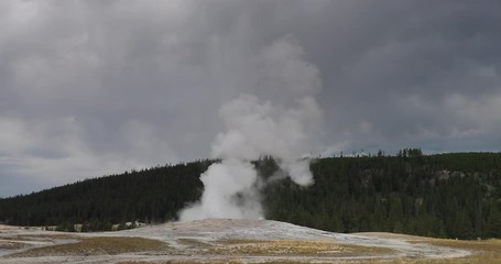 Yellowstone Old Faithful tourism erupt landscape slow . Cone geyser National Park in Wyoming. Predictable geothermal ecosystem. Caldera, largest super volcano on the continent. Geography and ecology.