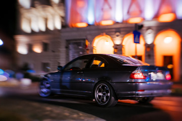 Fast business luxury prestige car lit in the dark - Powered by Adobe