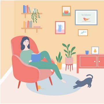 A girl reading a book at home
