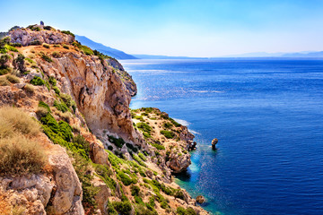 Fototapeta na wymiar Seascape from the rocky steep coast of the Ionian Sea in Greece.