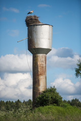 stork's nest on the rusty water tower