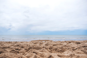 Fototapeta na wymiar Landscape image of sand on tropical beach with blue sky background