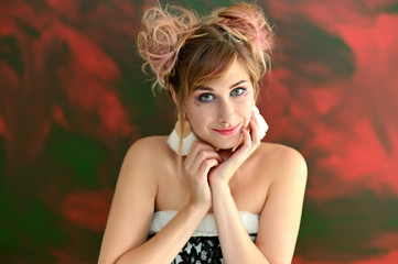 Close-up portrait of a pretty happy cool blonde girl with colored hair on a colorful background. Smiling in various poses, beauty, holiday.