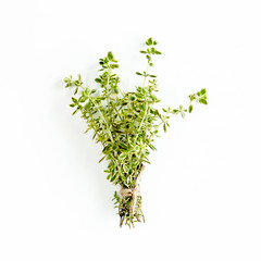 Green bundle of thyme isolated on a white background. Мedicinal herbs. Flat lay. Top view