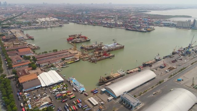 aerial view cargo and passenger seaport with ships and crane Tanjung Perak, surabaya, indonesia. docks for the repair and parking of ships, cargo port and container terminal. ship in industrial port