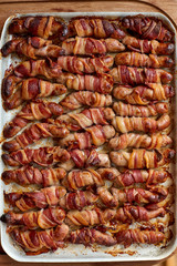 Overhead View of a Tray of Cooked Pigs in Blanket