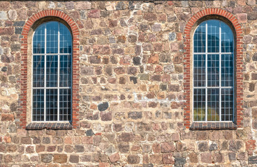 old stone wall with windows