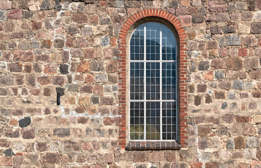 Fototapeta na wymiar Old stone wall with a window