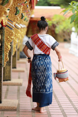 Fototapeta na wymiar Phu Thai Dress : young teen asian wear thai traditional dress.