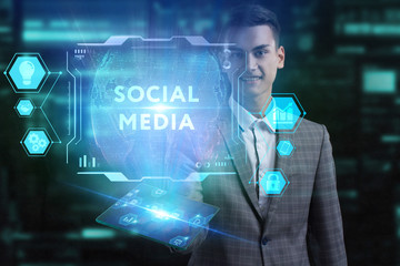 The concept of business, technology, the Internet and the network. A young entrepreneur working on a virtual screen of the future and sees the inscription: Social media