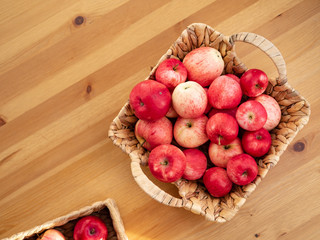 Ripe red apples in a wicker box. Top view with space for your text. Image for website banner