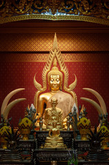 Beautiful golden Buddha sculptures in a temple