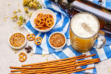 Oktoberfest set. Light beer, pretzels, mustard, sesame straw, hop.