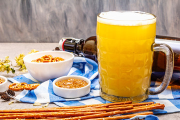 Oktoberfest set. Light beer, pretzels, mustard, sesame straw, hop.