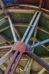 Louzal or Lousal pyrite Mine in Portugal, view of the rusty vintage water tank structure in the abandoned railway station.