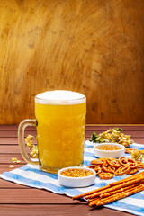 Oktoberfest set. Light beer, pretzels, mustard, sesame straw, hop.