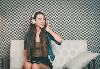 Young beautiful girl enjoy music.
