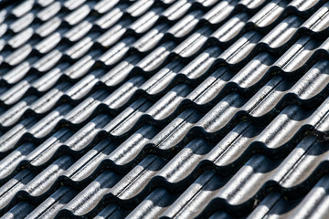 Abstract black roof with concrete tiles.