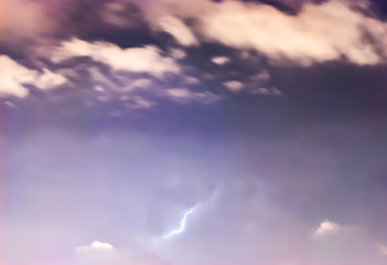 Thunderbolt at dramatic stormy dark blue sky. Selective Focus.