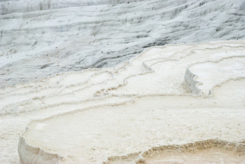 White Carbonate mineral travertine pools. Pamukkale, Turkey. Selective Focus.