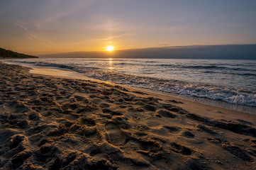 Colorful sunrise over the sea. Nature composition. Concept: holiday or calendar and picture postcards