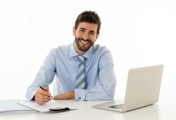 Fototapeta premium Attractive happy Young caucasian businessman working on laptop computer feeling successful at work