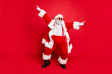 Full body photo of funky fat santa claus with big funny abdomen dancing raising arms wearing style...