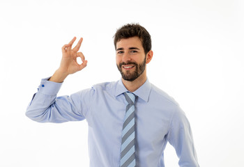 Portrait of young attractive businessman smiling and doing all OK sign Isolated on white background