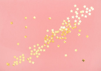 Fototapeta na wymiar Golden confetti pink color background Holidays flat lay