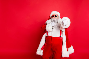 Portrait of fat overweight real pop star hipster santa claus with big abdomen broadcast sing songs...