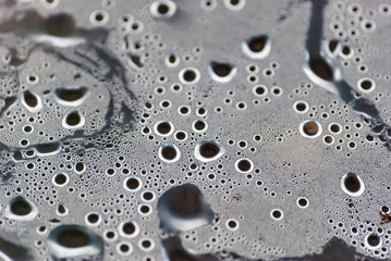 Water drops macro from under the plastic. Selective Focus.