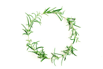 Round wreath frame made herbs, green branches, leaves rosemary. Flat lay. Top view.