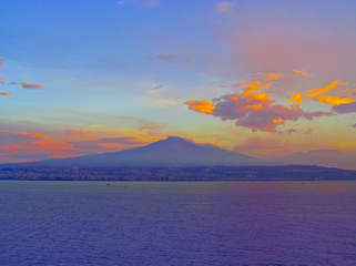 Mount Etna volcano on Sicily island, Italy. Panoramic view with sea; sunset; coast and famous...