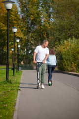 Fototapeta premium Man and woman on scooters