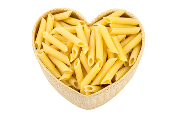 Top view dry pasta penne Italian food in heart shaped bamboo basket isolated white background with clipping path.