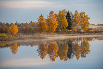 Morning on the river early morning reeds mist fog and water surface on the river