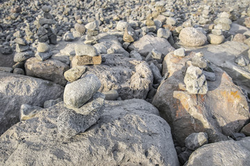 Stones of different shapes on the waterfront