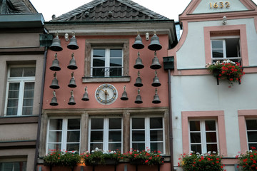 Historical bells in Dusseldorf old town, bells on the house facade