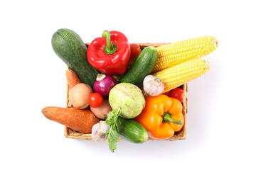 Fototapeta na wymiar Wicker basket with vegetables isolated on white background